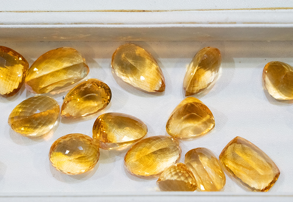 November Birthstone Guide for Retailers – Citrine & Topaz 3 Mixed cuts of yellow topaz gemstones image
