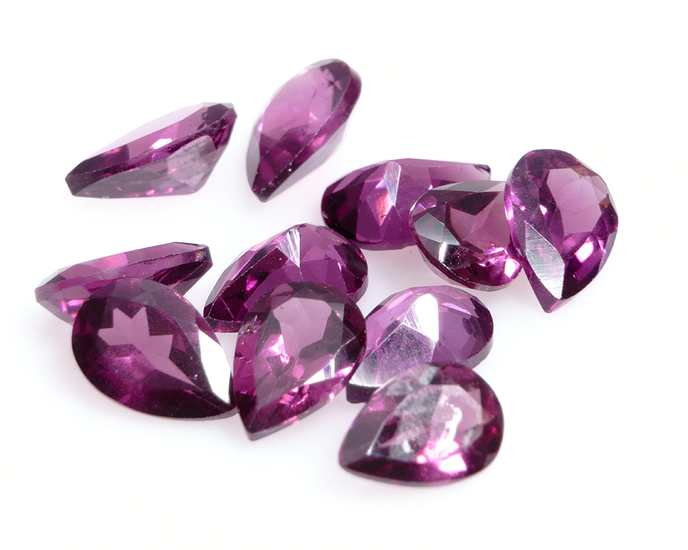 January Birthstone Guide for Retailers – Garnet 1 Pear shaped purple rhodolite garnet gemstones image