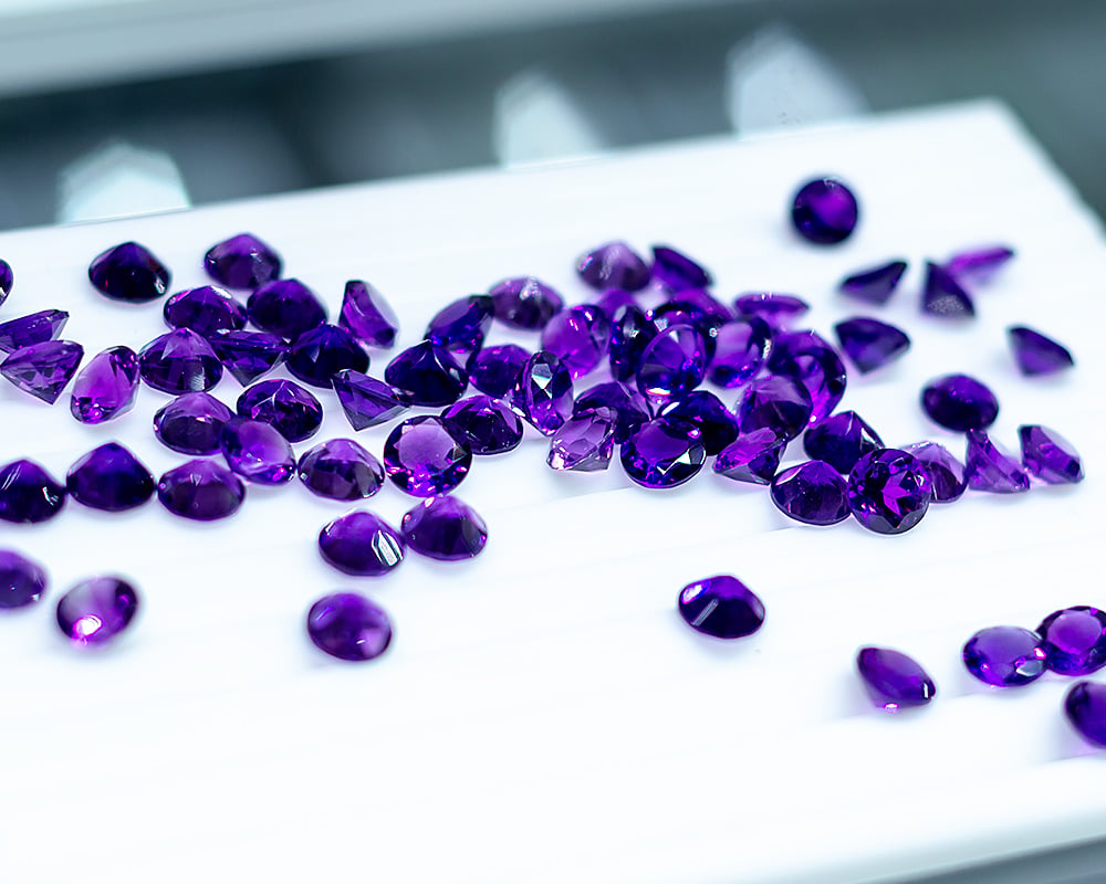 February Birthstone Guide for Retailers – Amethyst 1 Faceted deep purple amethyst gemstones for sale image